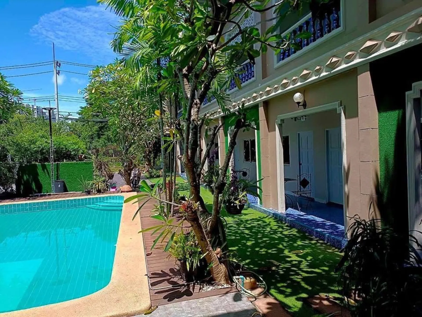 Pool and guest room building in daylight