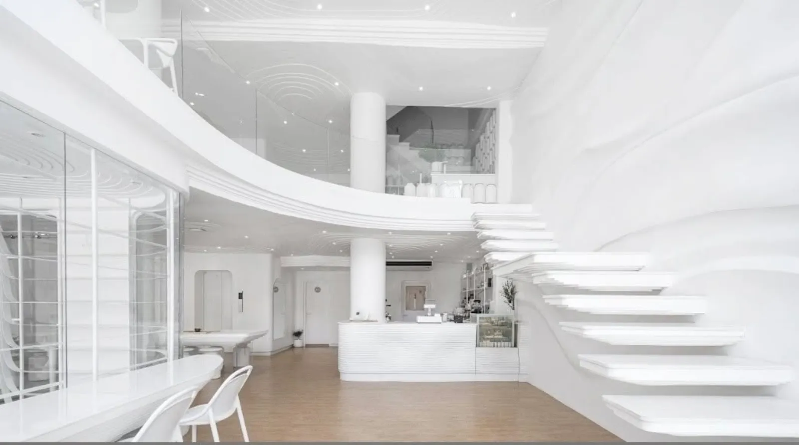 Double-height interior with sculptural floating staircase